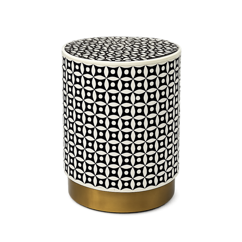 Round side table with black and white geometric pattern and gold base on a white background