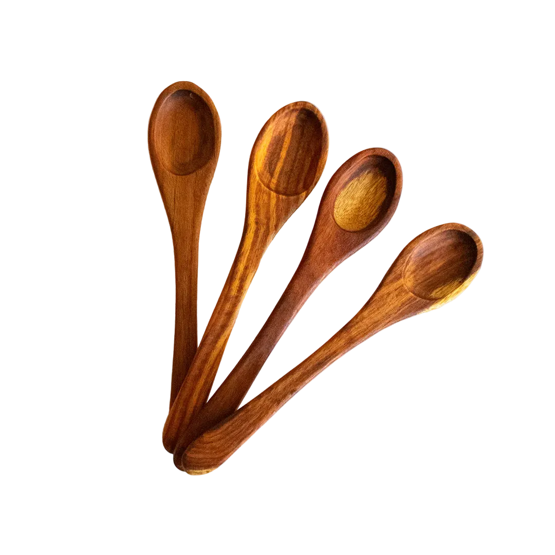 A set of four wooden table spoons with a smooth finish, displayed on a light background.
